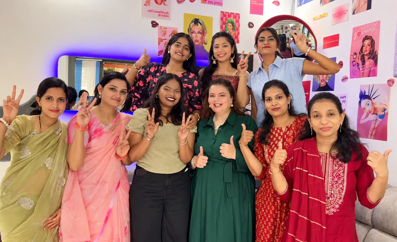 Rekha and her workshop students smiling together in the studio